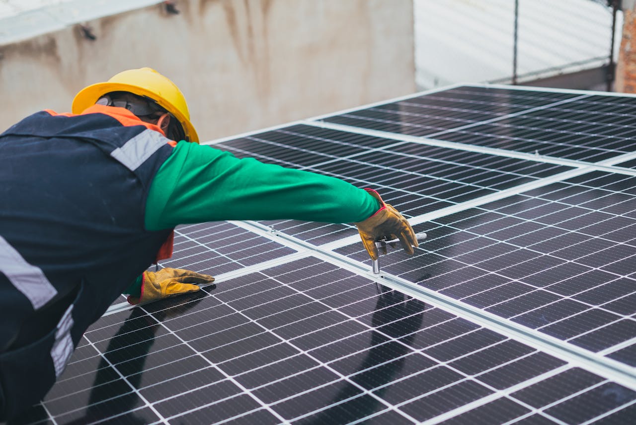 solar technician installing solar panel 8853502